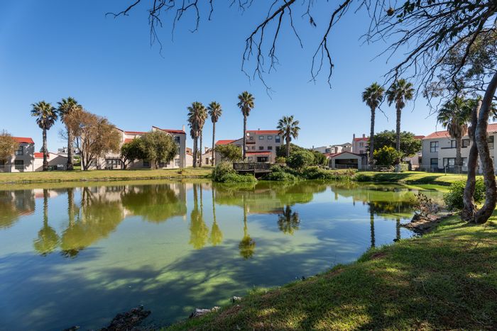 For Sale: Apartment in Greenways Golf Estate with lagoon views and communal pool.