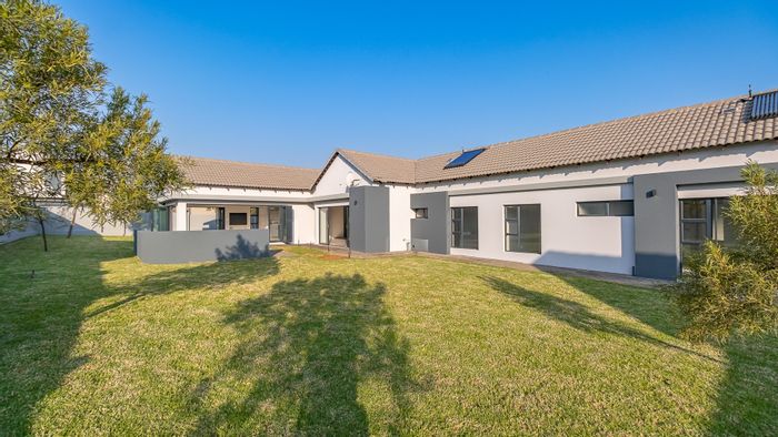 For Sale: Spacious 4-Bedroom House in Midstream Meadows with Triple Garage and Amenities.