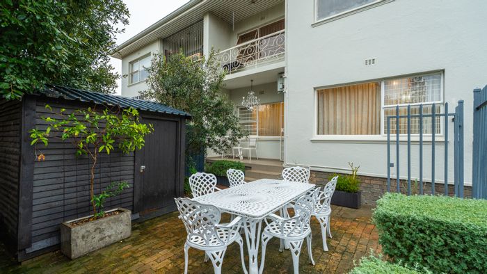 For Sale: Two-bedroom apartment in Stellenbosch Central with private courtyard and income potential.