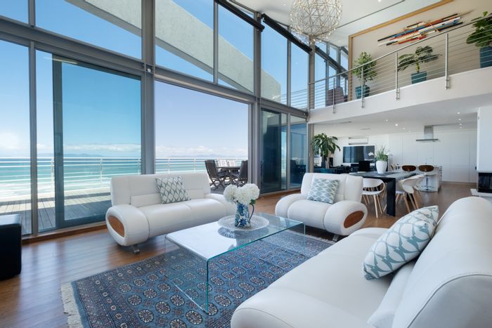 For Sale: Luxurious Strand North Apartment with panoramic views, gym, and pool.