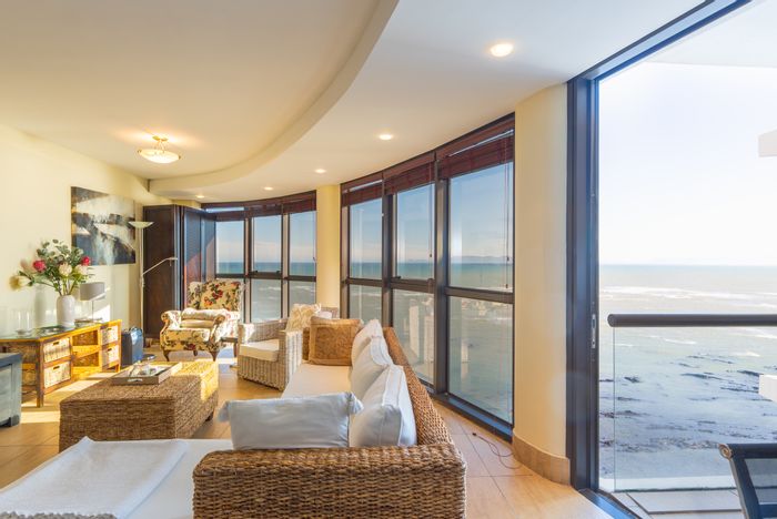 For Sale: Strand South Apartment with ocean views, balcony, and secure parking.