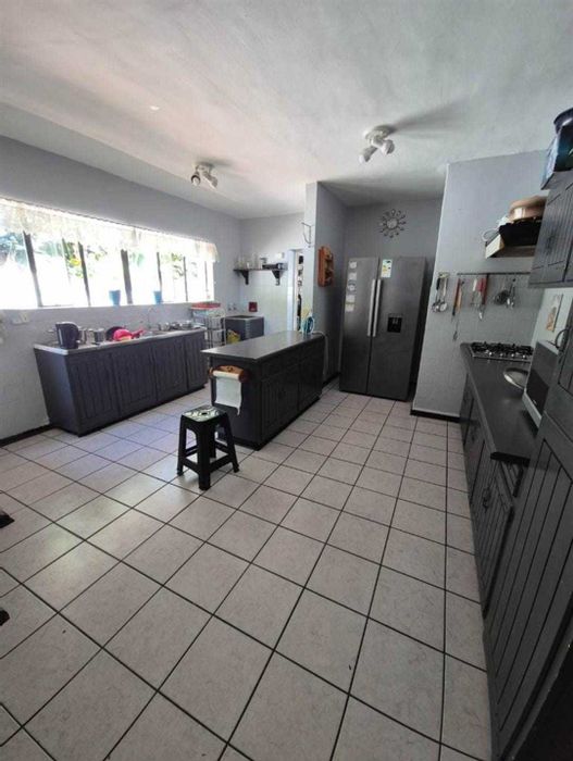 For Sale: 4-Bedroom House in Bluewater Bay with Pool, Office Space, and Double Garage.