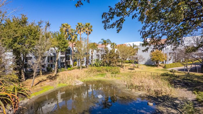 2-Bedroom Apartment For Sale in Magaliessig with Balcony, Security, and Amenities.