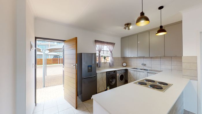 3-Bedroom Apartment for Sale in Monavoni with Private Garden and Security Access.