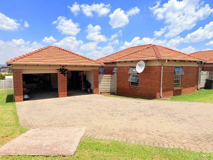 For Sale: Thatch Hill Estate House with 3 beds, double garage, and yard space.