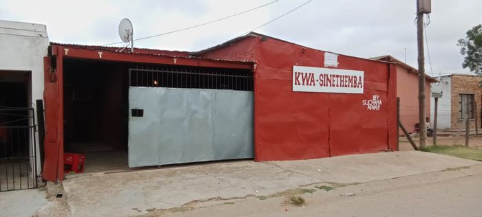 Kwanobuhle House For Sale: Unique Shebeen setup with two bedrooms and ample space.
