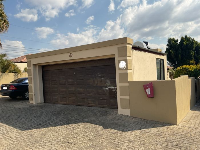For Sale: 3-bedroom townhouse in The Reeds with private garden and garages.