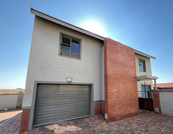 For Sale: Townhouse in Waterberry Country Estate with solar power, garden, and garage.