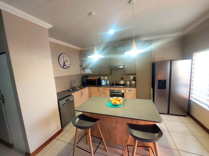 3-Bedroom Townhouse in Montana For Sale with patio, double garage, and security.