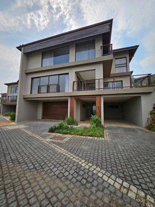 For Sale: Zimbali Townhouse with multi-level design, sea views, and ample parking.