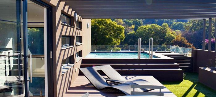 Penthouse for Sale in Forest Town: Rooftop garden, pool, panoramic skyline views.