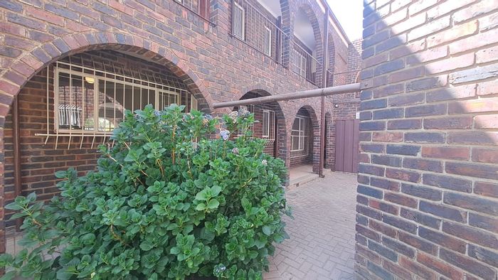 Two-bedroom flat in Three Rivers with open-plan living and secure garage, To Rent.