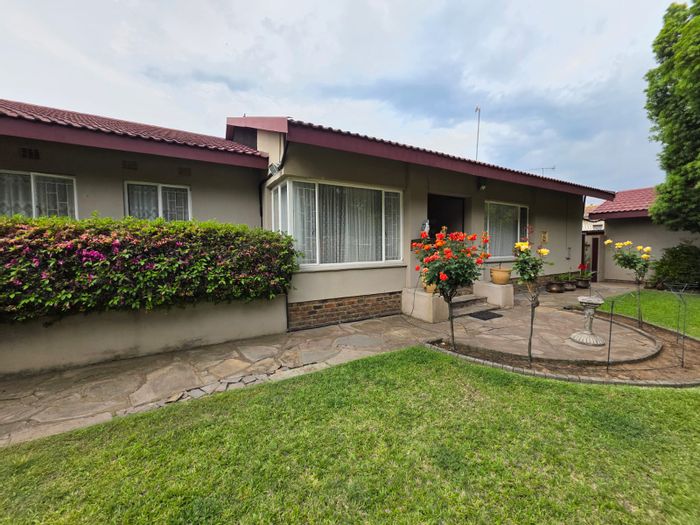 For Sale: House in Sasolburg Ext 11 with solar, garden, and double garage.