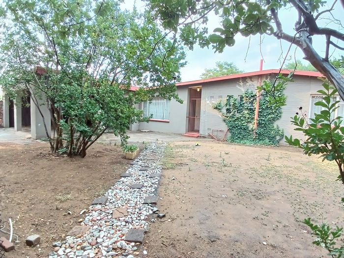 For Sale: House in Sasolburg Ext 12 with spacious living, entertainment area, and potential.