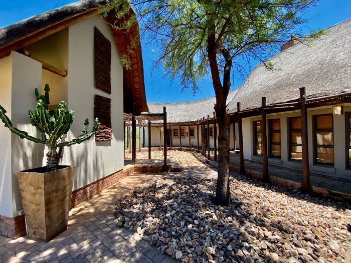 For Sale: Townhouse at Zebula Golf Estate with pool, outdoor showers, and golf cart.