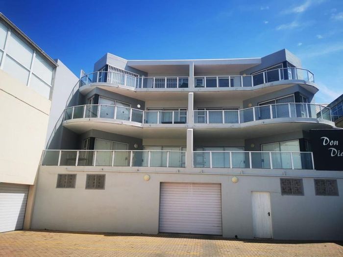 Beachfront apartment in Jeffreys Bay Central for sale, includes sea views and parking.