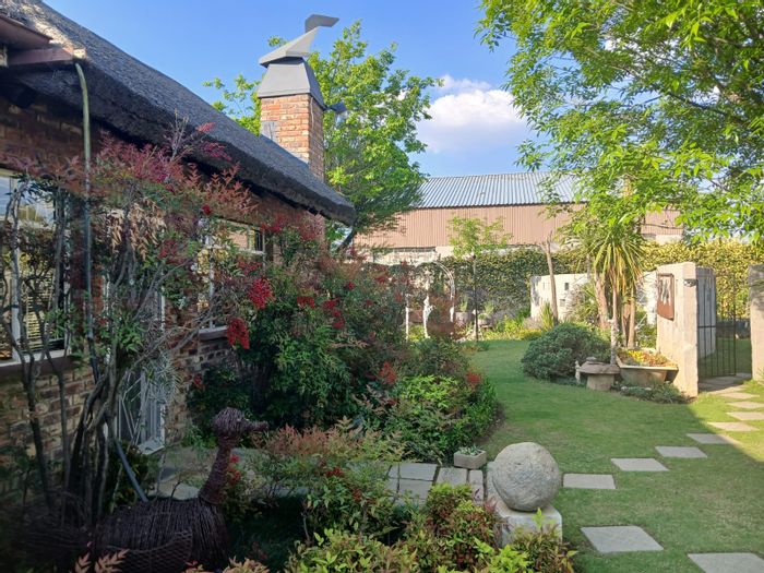 For Sale: Marquard Central House with 3 beds, 2-bed apartment, and landscaped garden.