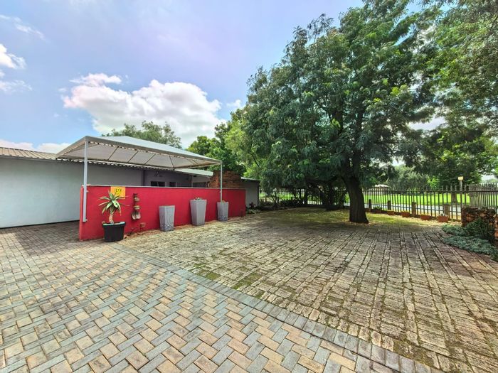 For Sale: Spacious 4-Bedroom House in Sasolburg Ext 12 with outdoor braai area.