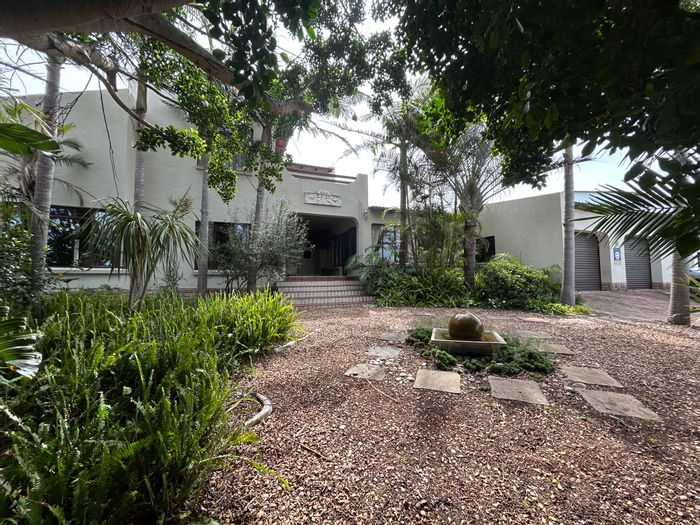 For Sale: Spacious Ferreira Town house with pool, flatlet, and three garages.