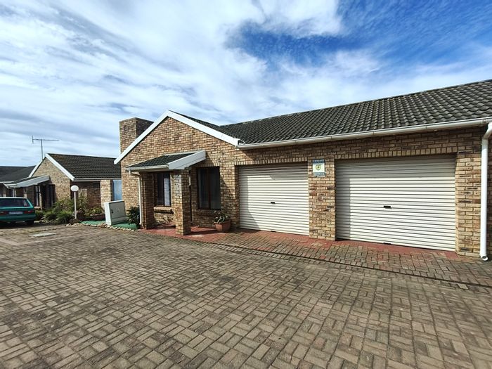 For Sale: Townhouse in Jeffreys Bay Central with garden, double garage, and secure complex.