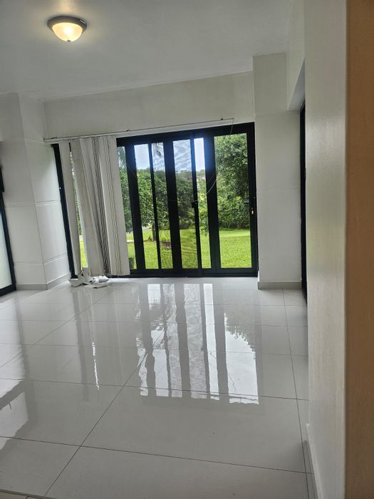 Ground-floor apartment for sale in Palm Lakes Estate with private garden access.