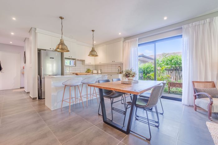 For Sale: Townhouse in Brettenwood Coastal Estate with private garden, double garage, and solar.