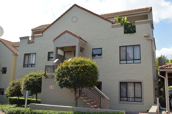 Douglasdale Townhouse For Sale: Spacious duplex with loft, balcony, pool access.