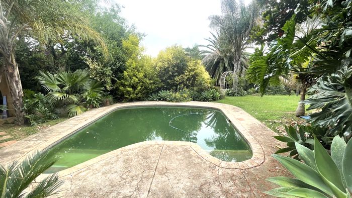 For Sale: Waterkloof Ridge house with dual homes, ideal for redevelopment.