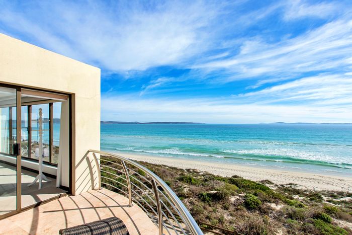 Beachfront house in Calypso Beach for sale, 5 bedrooms, 6-car garage, granny flat.