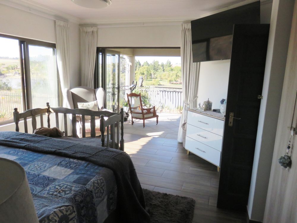 Main bedroom river views opening to deck