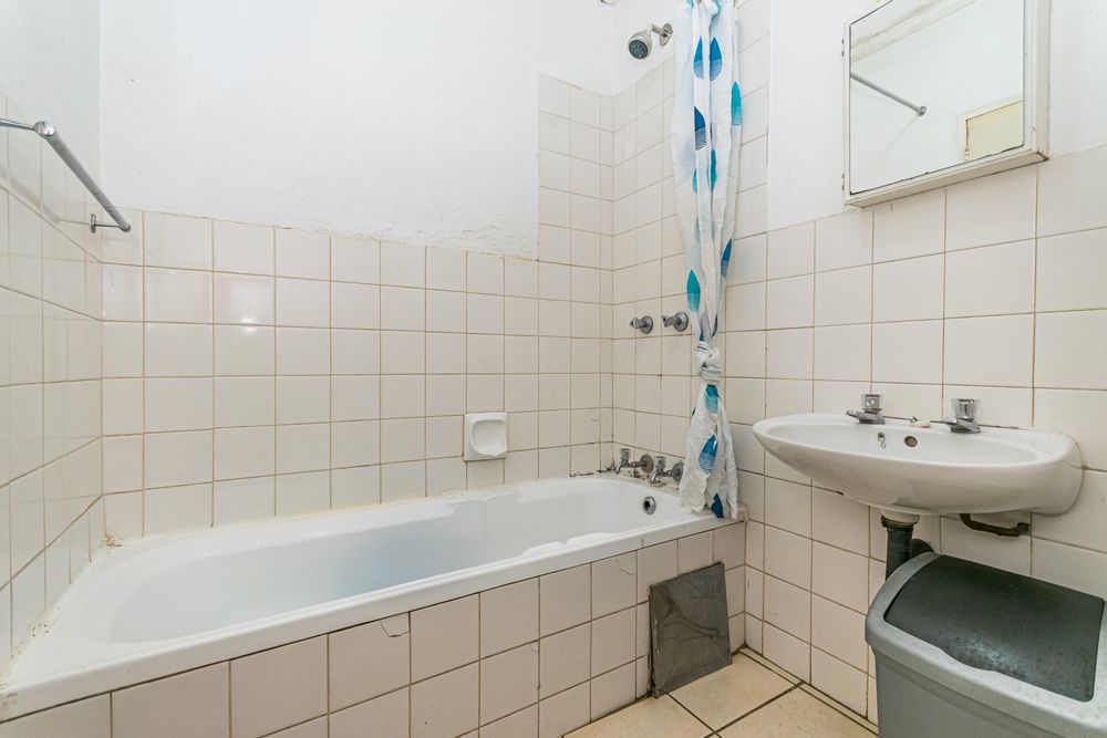 Bathrooom with shower over bath