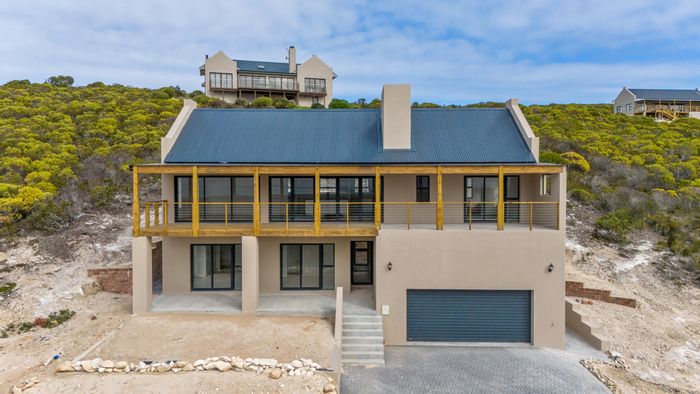 For Sale: House in Agulhas Central with 4 bedrooms, nature reserve access, and open-plan living.