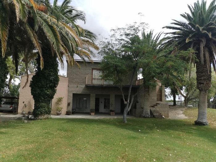 For Sale: Beaufort West Rural Farm with irrigation, boreholes, and livestock facilities.