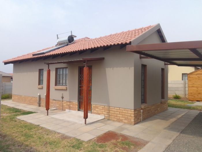 For Sale: Townhouse in Waterkloof East with garden, spacious bedrooms, and secure estate.