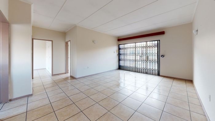 Spacious 2-bedroom apartment for sale in Potchefstroom Central with covered parking.