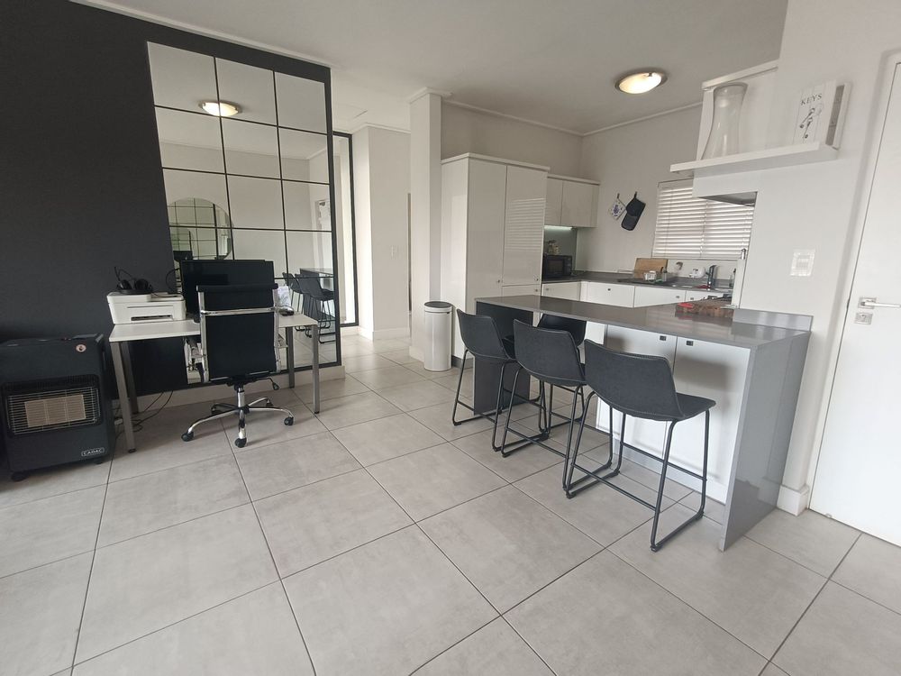 Living Area leading to the Modern Kitchen