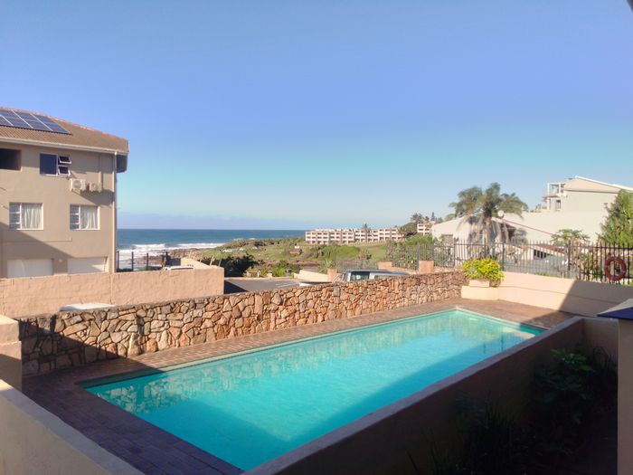 1-Bedroom Apartment in Uvongo For Sale with Pool, Beach Access, and Secure Parking.