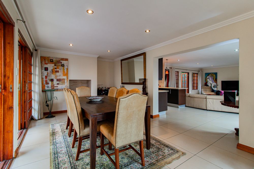 Diningroom has a gas fireplace and is open plan to livingroom