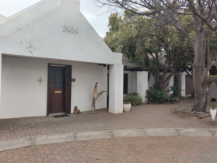 4-Bedroom Townhouse For Sale in Protea Park with secure outdoor space and parking.