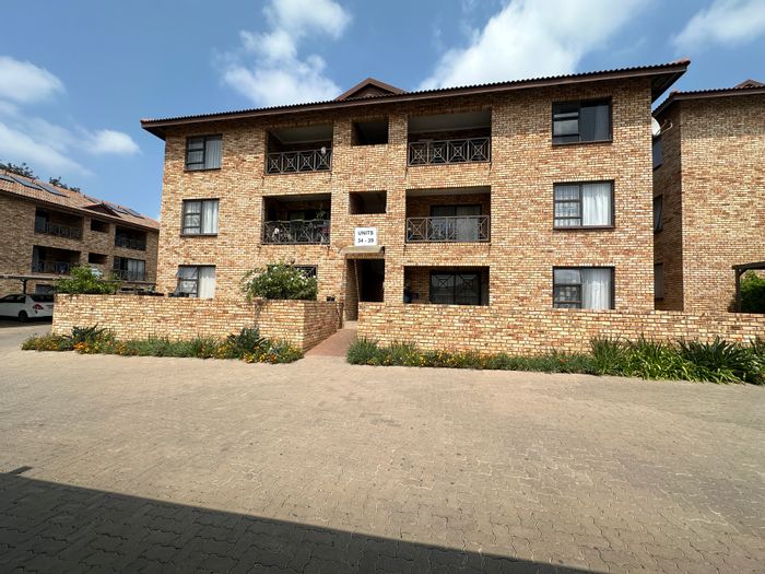 For Sale: 2-Bedroom Apartment in Honeydew with balcony, pool, and double carport.