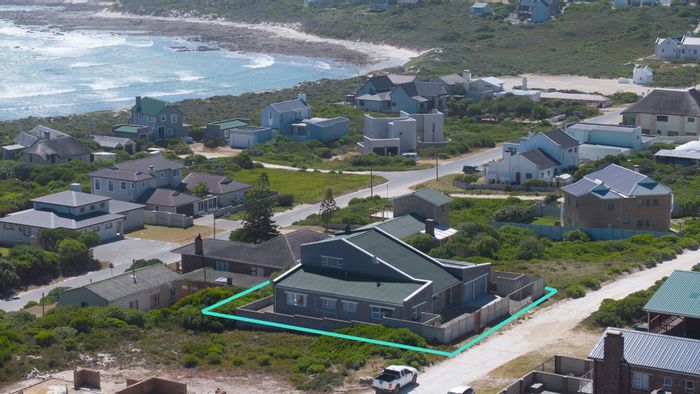 For Sale: House in Suiderstrand Central with ocean views, 5 bedrooms, and solar power.