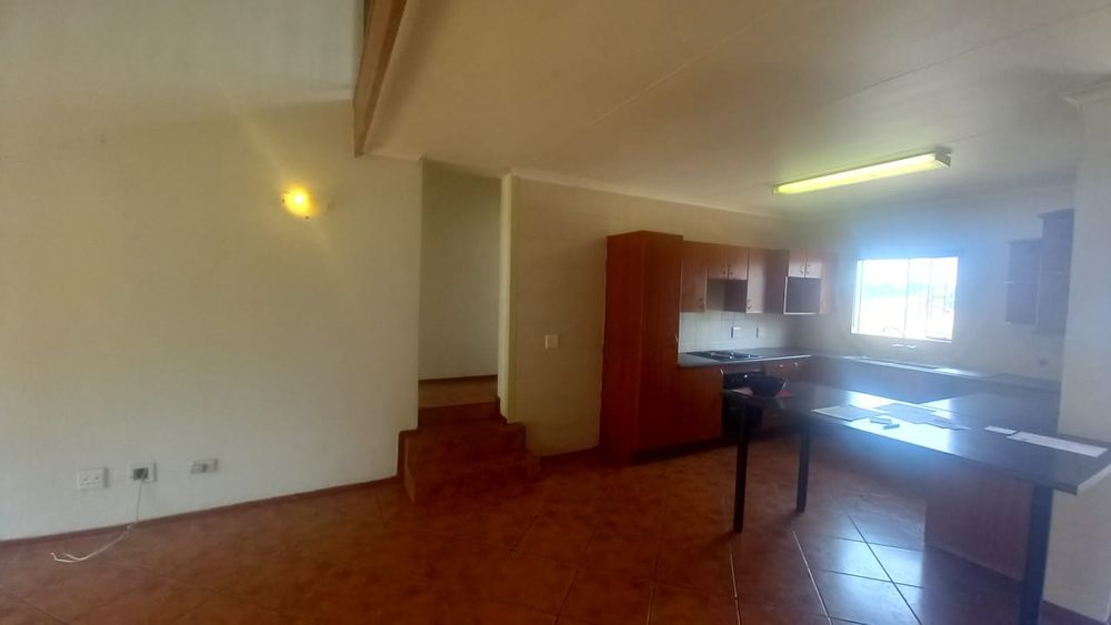 Kitchen and stairs to bedrooms
