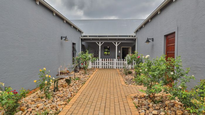For Sale: Spacious 6-bedroom house in The Coves with flatlets, gardens, and amenities.