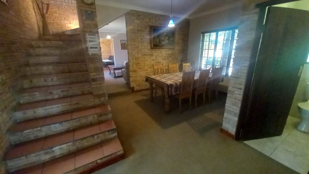 Open plan living areas and stairs to bedrooms
