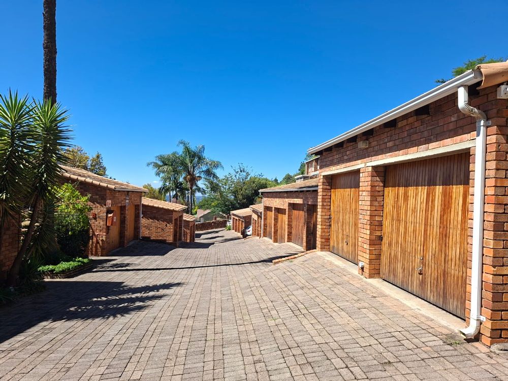 Road from entrance gate to unit at end