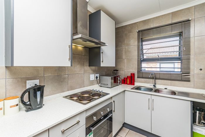 Groblerpark Townhouse For Sale: 2 bedrooms, garden, secure parking, 24/7 security.