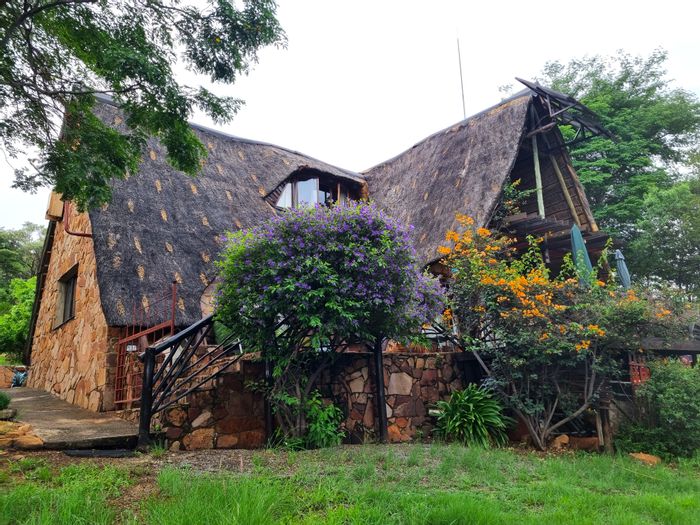 For Sale: House in Utopia Nature Estate with communal pools, tennis courts, and hiking trails.