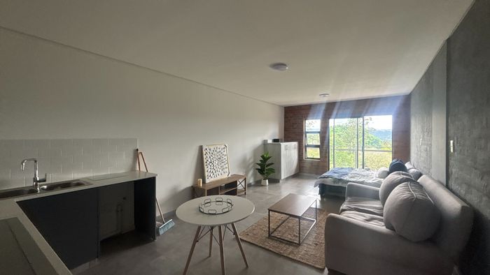 Athlone Apartment To Rent: Studio with coworking space, security, and nearby amenities.