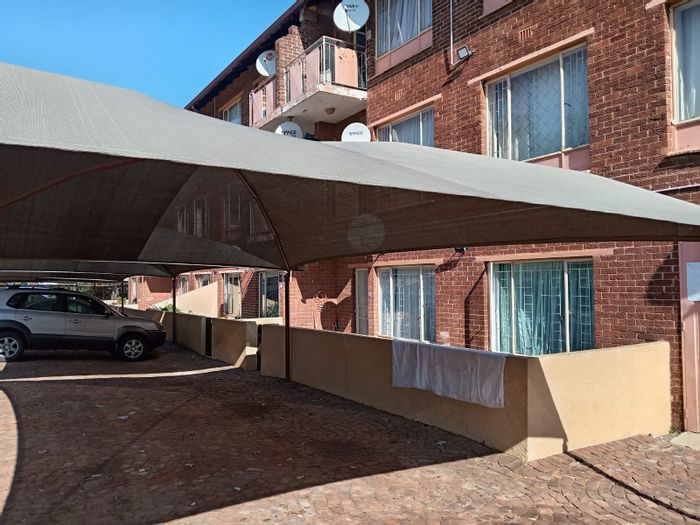 Witpoortjie Apartment For Sale: 2 Bedrooms, Secure Complex, Covered Parking, Relaxing Patio.
