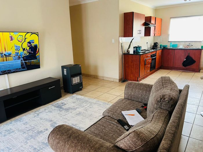 For Sale: Flat in Waterval East with 3 bedrooms, garden, and secure parking.